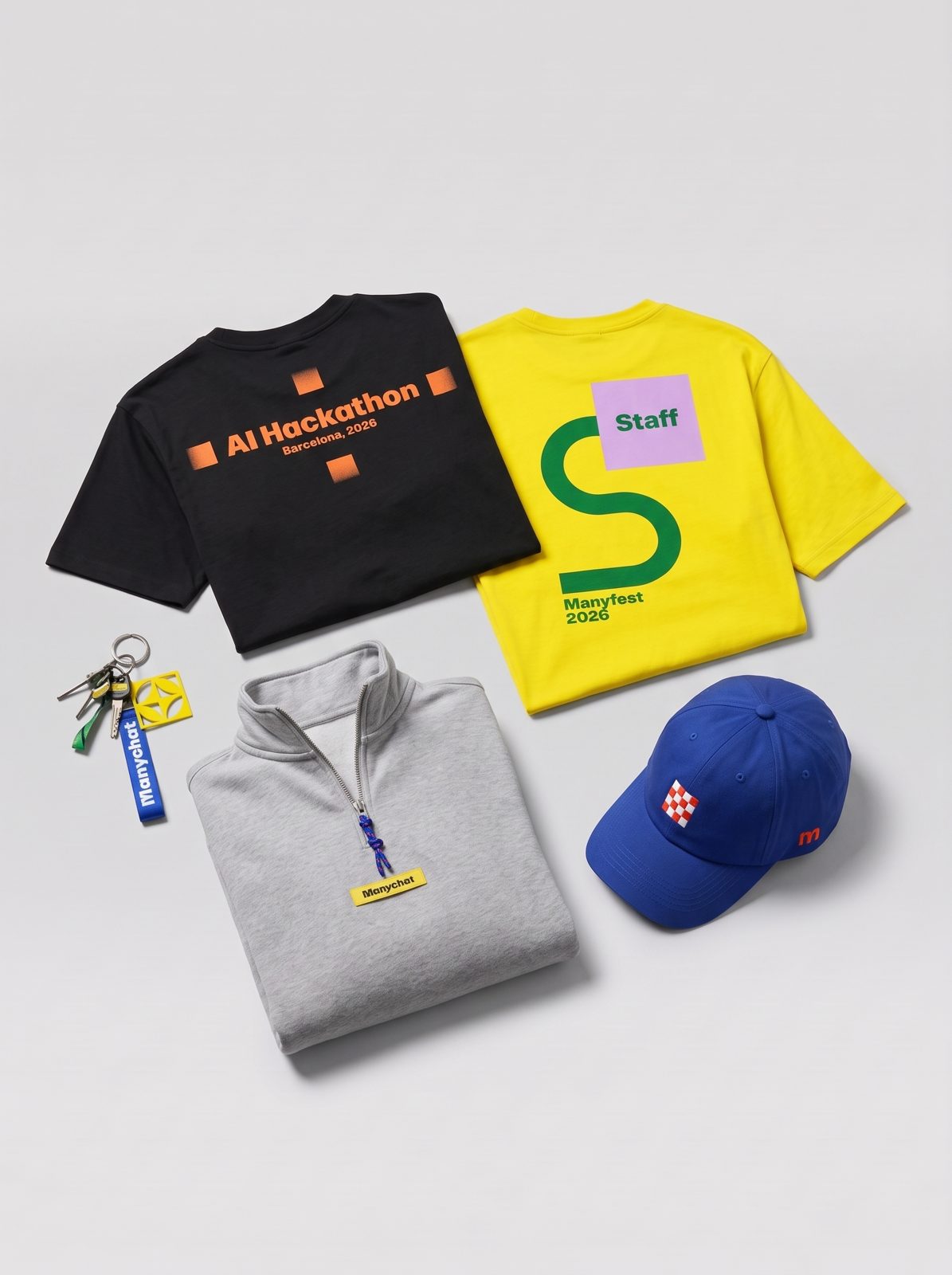 The same objects in a second arrangement, the keychain beside the folded T-shirts