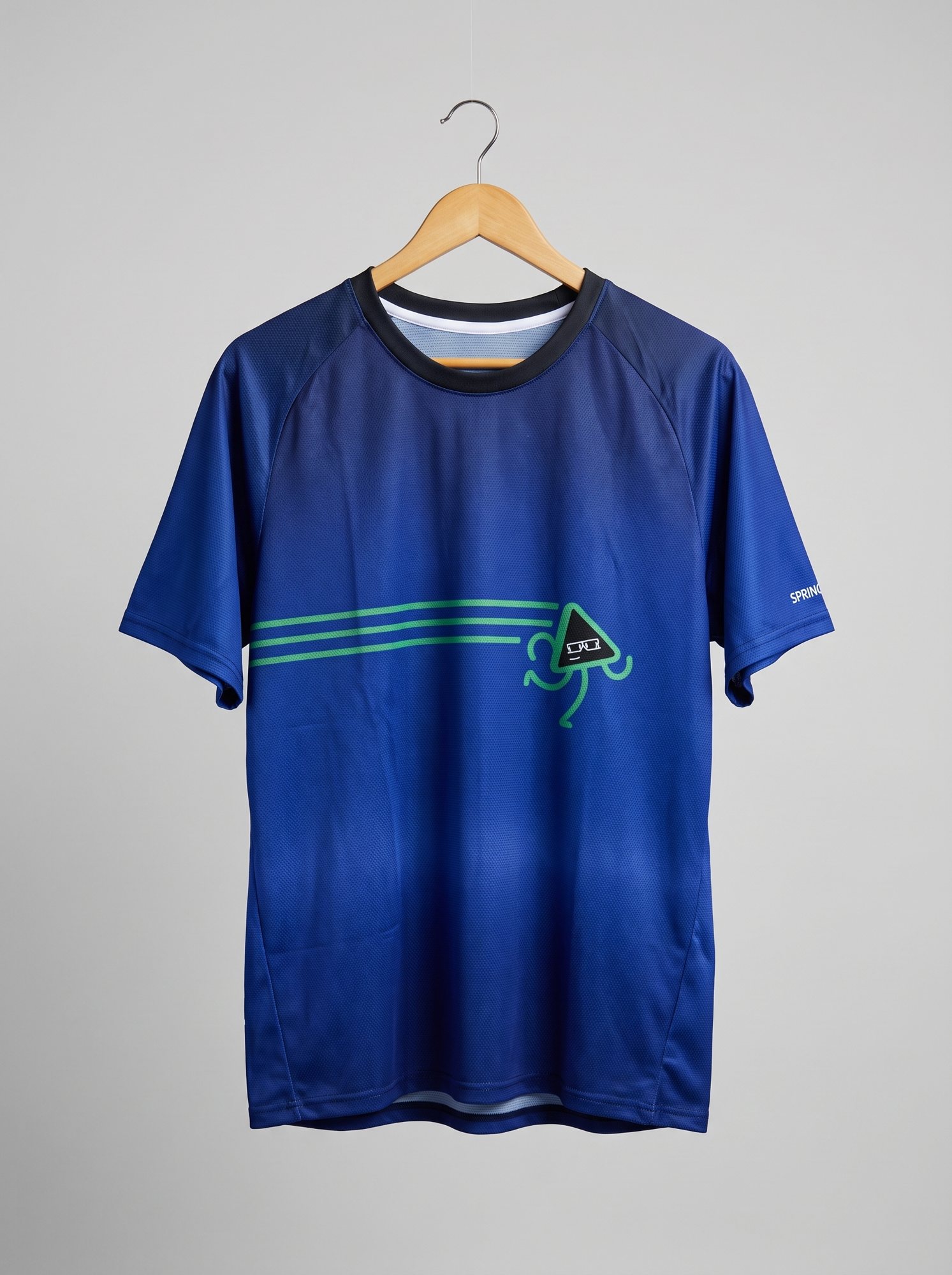 The finished tee on a hanger, Runzo running across the chest on three green lines