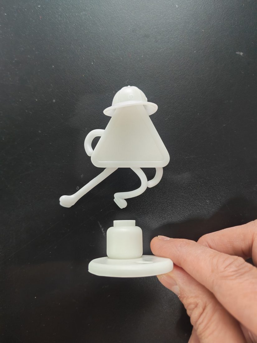 A white unpainted prototype of the figure