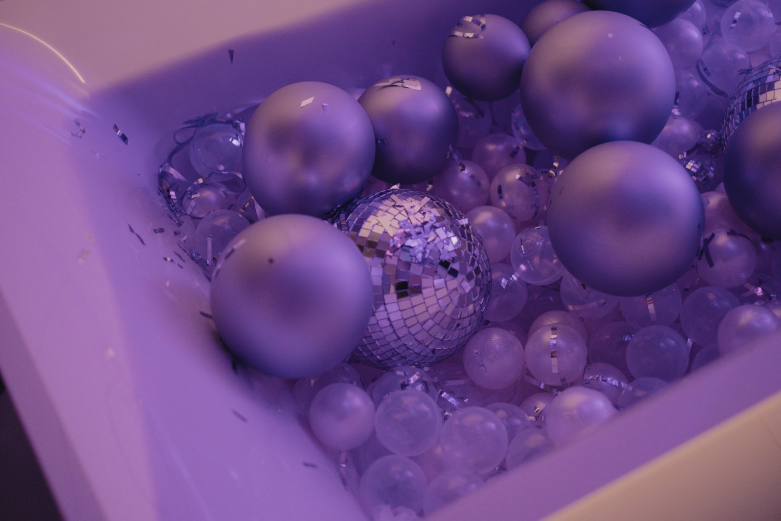 Silver balls and a disco ball in the bathtub