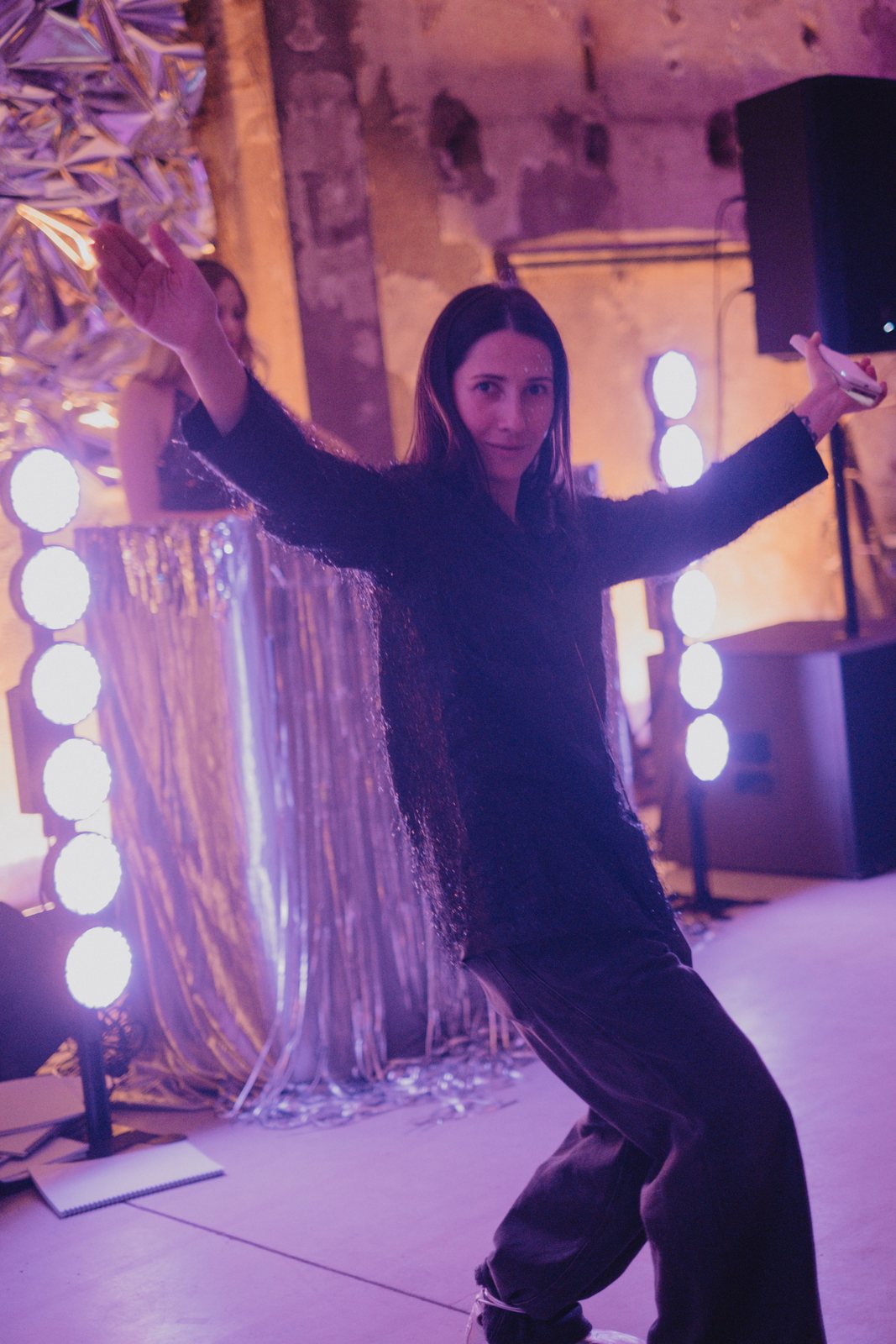 Dancing in front of the tinsel and stage lights