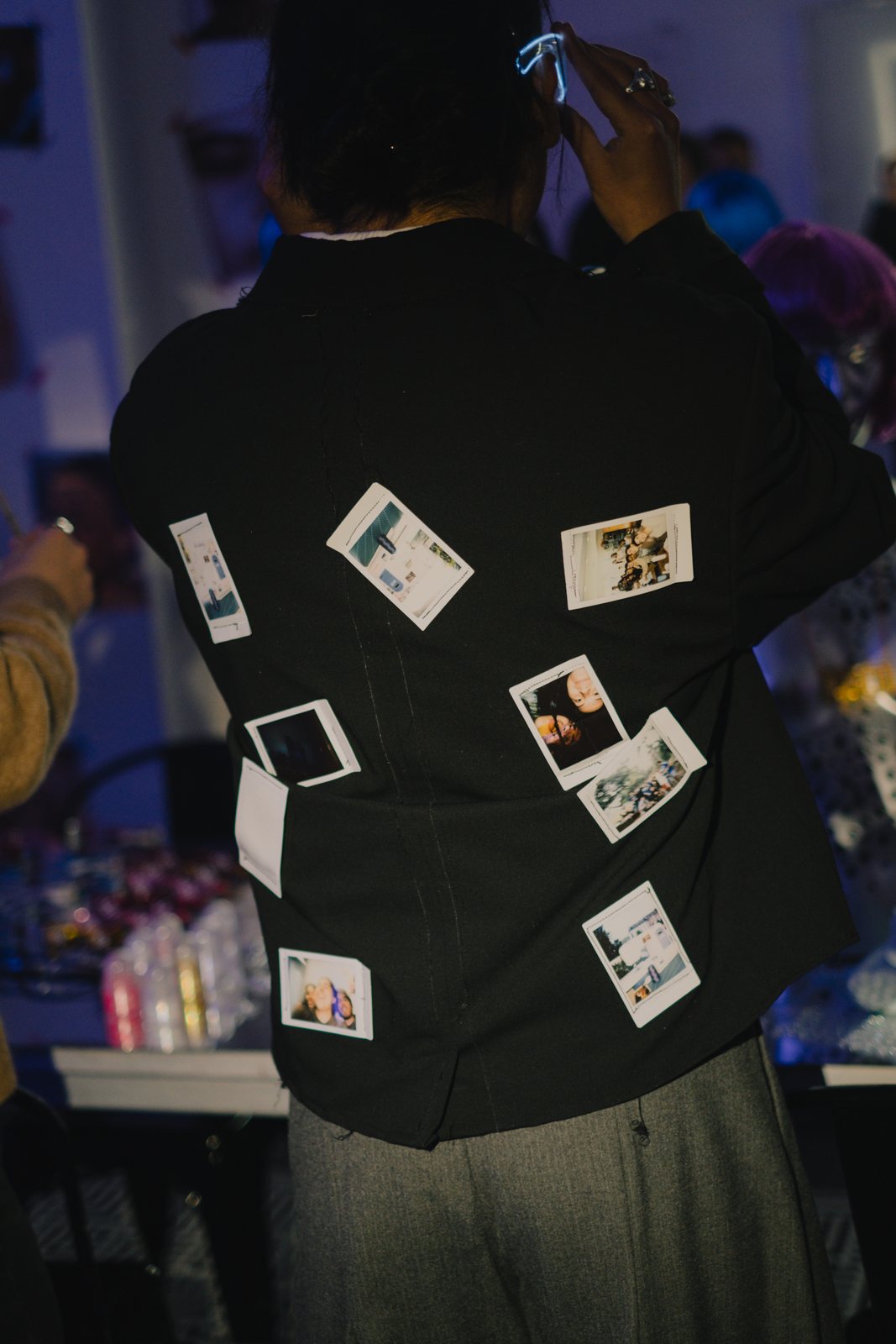 A jacket covered in instant photos