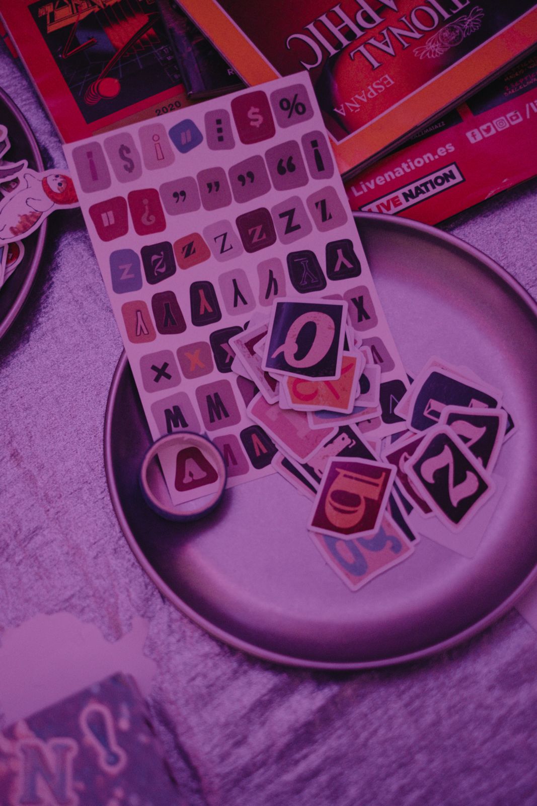 Letter stickers on a silver plate