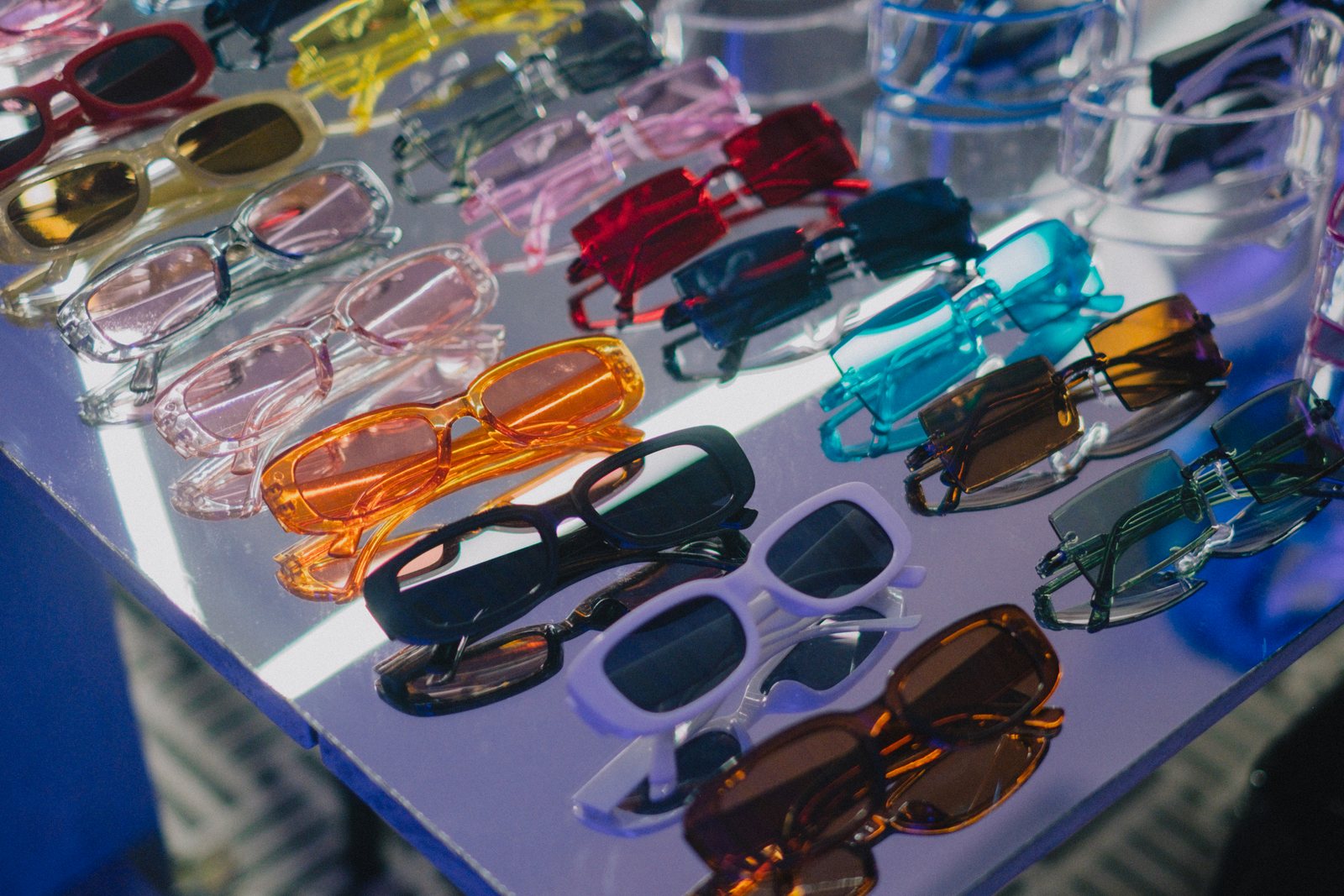 Rows of coloured party sunglasses
