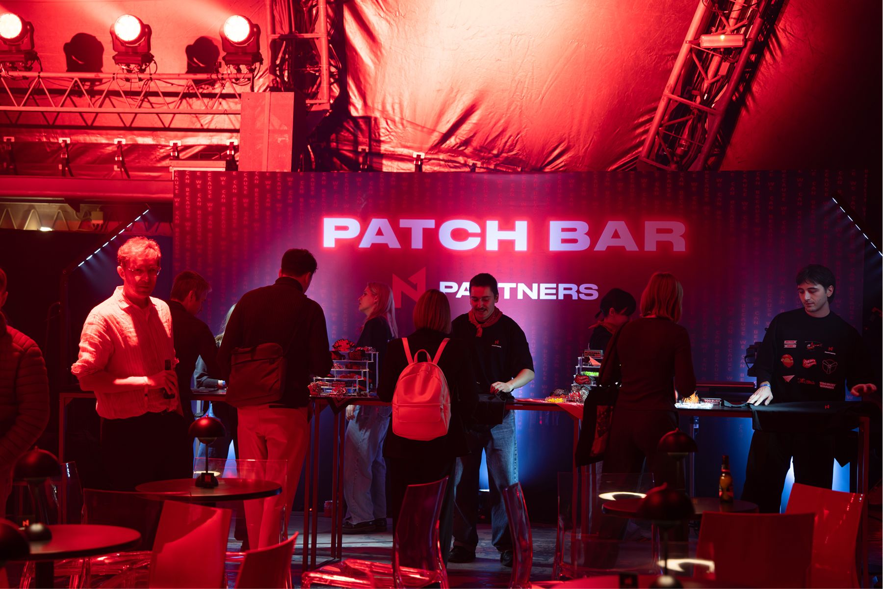 The Patch Bar under the red N1 Partners sign, the crew and guests