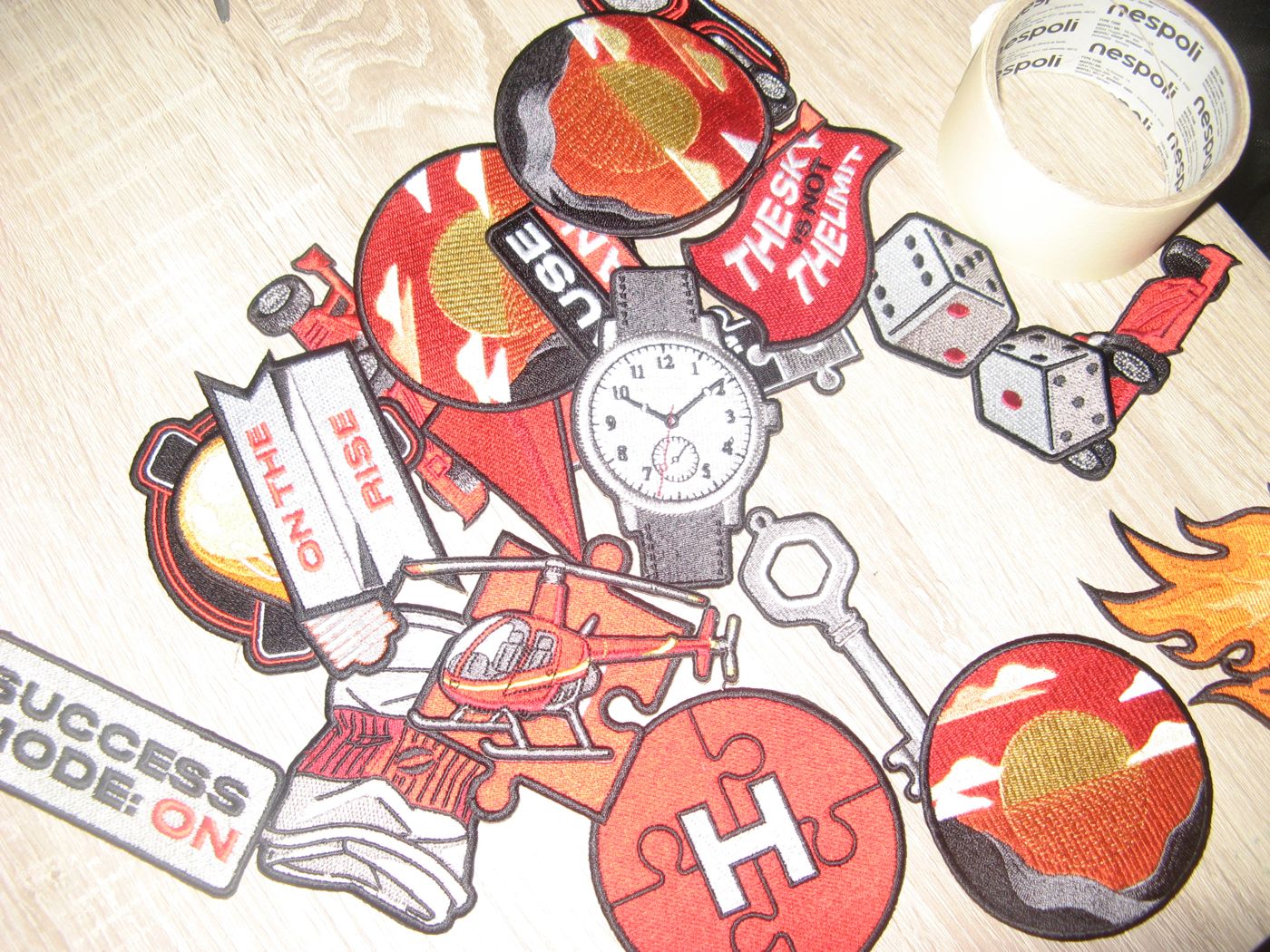 A pile of finished patches on a table