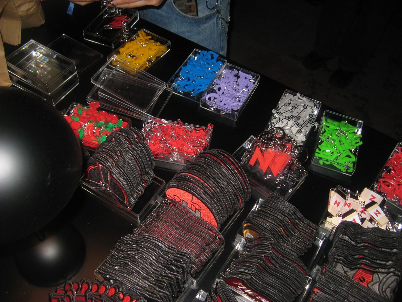 Trays of acrylic letters in yellow, blue, lilac, green and red
