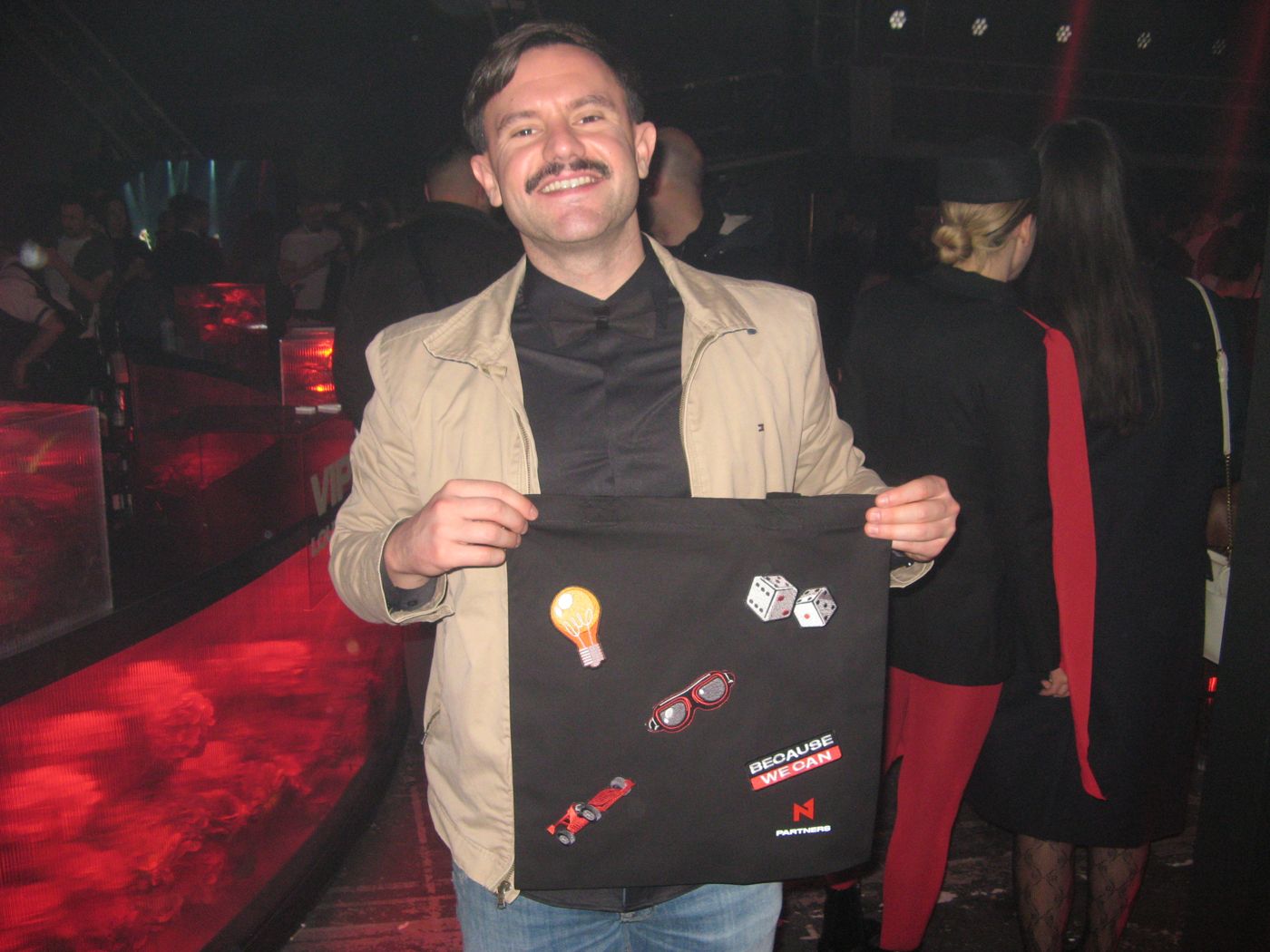 A guest with a small tote of patches
