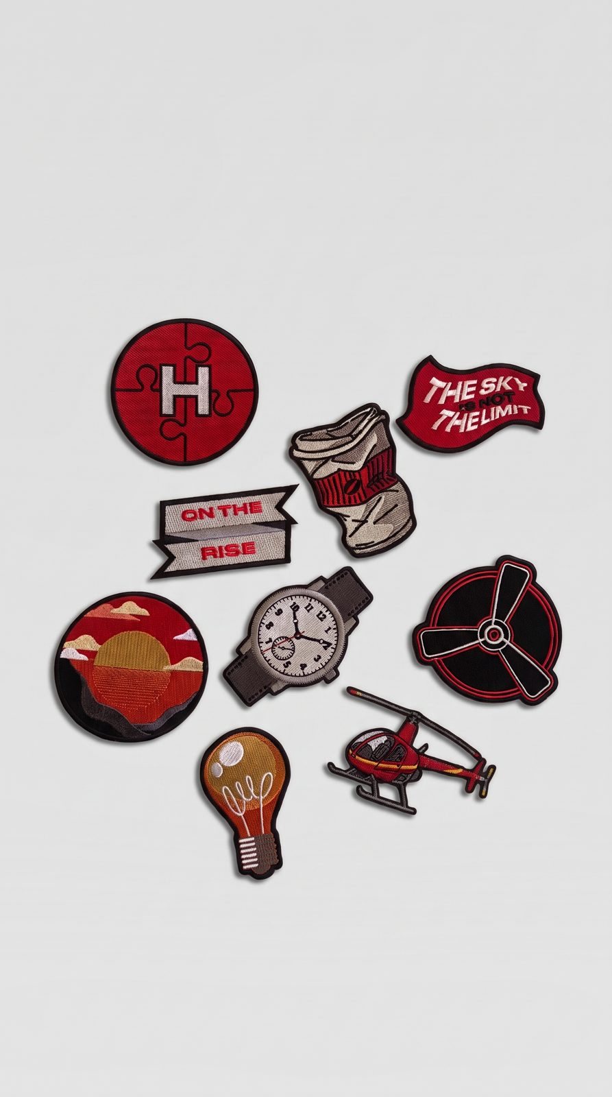 Embroidered patches from the N1 Partners collection on a grey ground